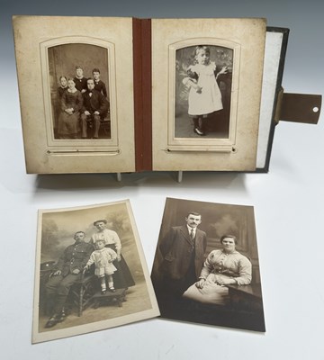 Lot 321 - A Victorian leather bound photograph album,...