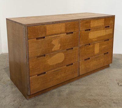 Lot 810 - An oak veneered chest of drawers with eight...