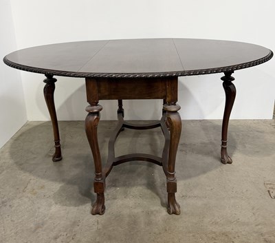 Lot 762 - An early 20th century mahogany oval drop leaf...