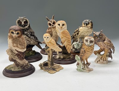 Lot 40 - A collection of owl figurines, including:...