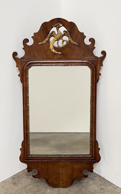 Lot 717 - A 19th century walnut Chippendale style mirror...