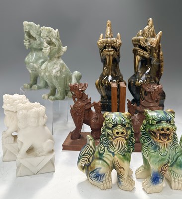 Lot 50 - Pairings of various Chinese guardian figurines,...