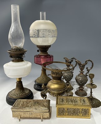 Lot 68 - Three late 19th-century glass and brass oil...