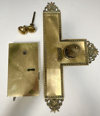 Lot 260 - A 19th century brass door knob and back plate,...