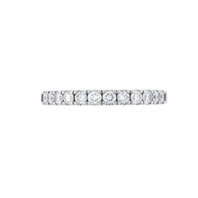 Lot 102 - Vera Wang, a platinum brilliant-cut diamond half eternity Love ring, with sapphire terminal detail