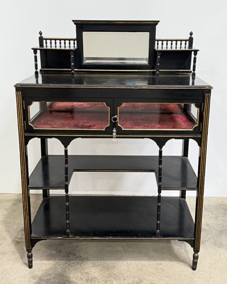 Lot 819 - An ebonised Aesthetic Movement bijouterie...