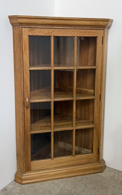 Lot 829 - A 20th century walnut corner cabinet in the...