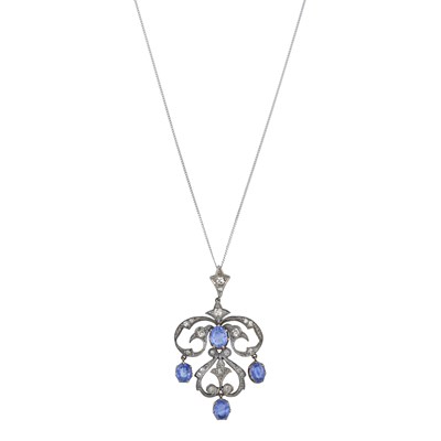 Lot 2 - An Edwardian silver and gold sapphire and diamond pendant, with later 18ct gold chain