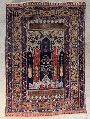Lot 704 - A 20th-century prayer rug, purple field with...