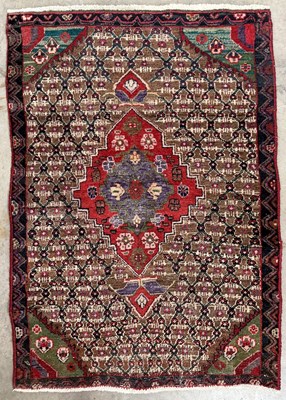 Lot 712 - A 20th century Persian wool rug, possibly...