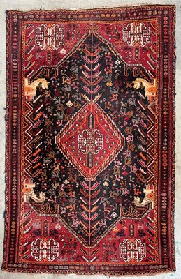 Lot 711 - Shiraz type knotted wool rug, in a...
