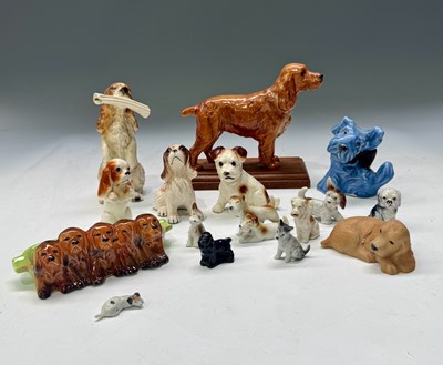 Lot 41 - A collection of ceramic dog figurines,...