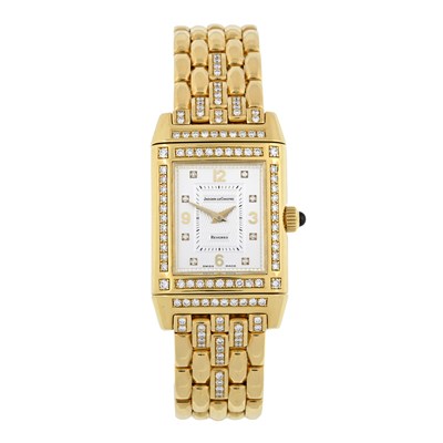 Lot 218 - Jaeger-LeCoultre, an 18ct gold diamond set Reverso bracelet watch