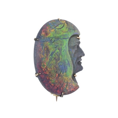Lot 84 - A carved opal brooch