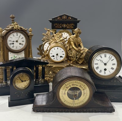 Lot 82 - A collection of clocks including: figural cast...