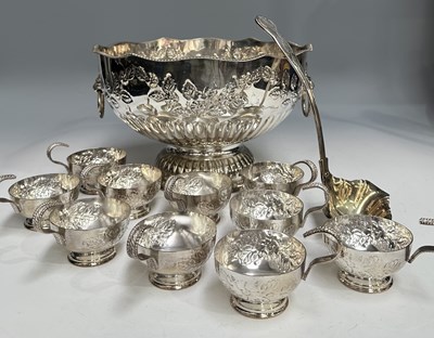 Lot 355 - A silver plate repoussé punch bowl with ladle...