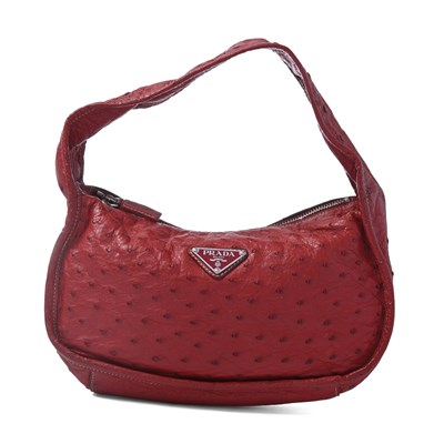 Lot 540 - Prada, a small red ostrich leather hobo handbag.