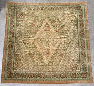 Lot 710 - An Oriental-type tufted rug with a central...