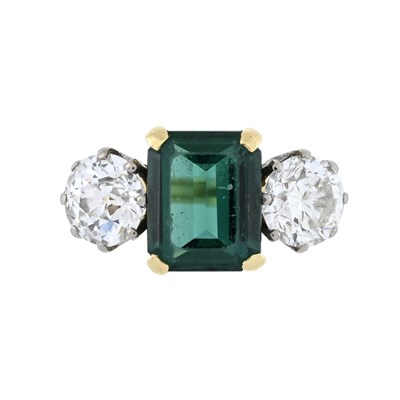 Lot 167 - An 18ct gold synthetic emerald, brilliant-cut and transitional-cut diamond three stone ring
