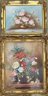 Lot 564 - Still life paintings of flowers in vases: one...