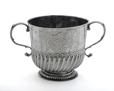 Lot 242 - A Queen Anne silver two-handled cup, by...