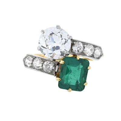 Lot 18 - Tiffany & Co., an early 20th century 18ct gold Colombian emerald and old-cut diamond crossover ring