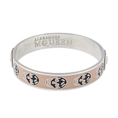 Lot 253 - Alexander McQueen, an enamel skull bangle.