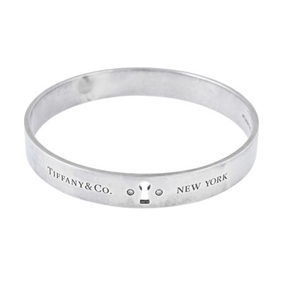 Lot 577 - Tiffany & Co., a silver Keyhole brilliant-cut diamond bangle.