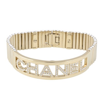 Lot 341 - Chanel, a colourless paste Chanel openwork plaque bracelet.