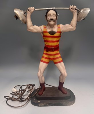 Lot 311 - A novelty lamp modelled as a squatting...