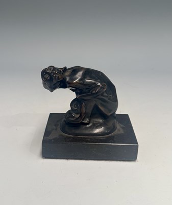 Lot 378 - A cast metal monkey figure, bronze finish,...