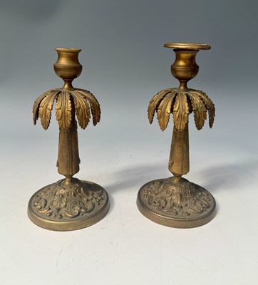 Lot 380 - A pair of cast brass candlesticks, 19th...