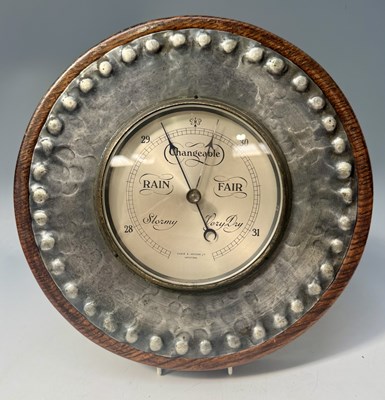 Lot 373 - A wall hanging barometer, round silvered dial...