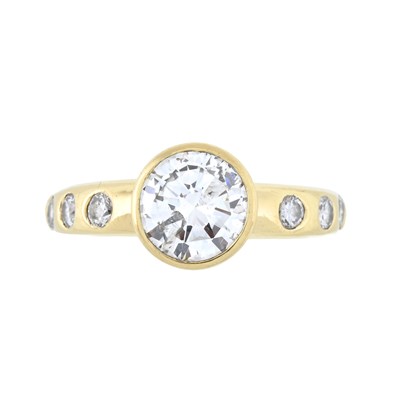 Lot 198 - An 18ct gold brilliant-cut diamond ring, with diamond set shoulders