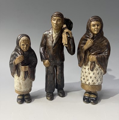 Lot 68 - Three stoneware Art Pottery figures, chimney...
