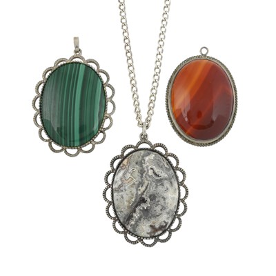 Lot 245 - Three hardstone pendants with one chain