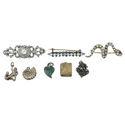 Lot 254 - Three late 19th to early 20th century paste brooches and five charms