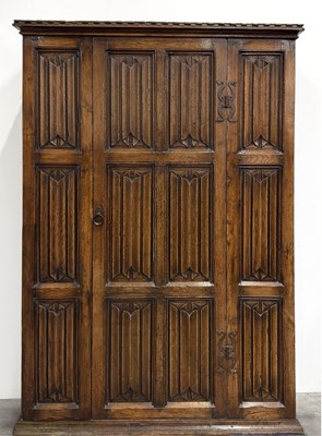 Lot 510 - An early 20th century reproduction oak linen...