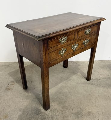 Lot 472 - An early 19th century Georgian walnut lowboy...