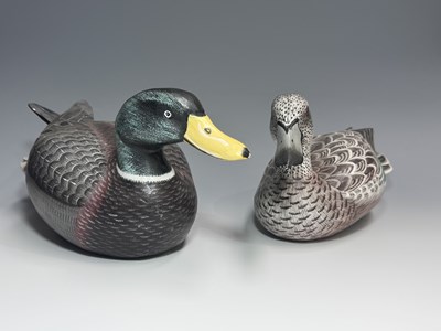 Lot 151 - Two hand carved and painted wooden decoy...