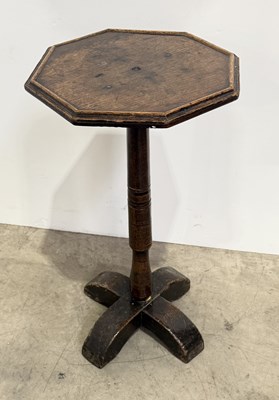 Lot 454 - A 17th century oak and English hardwood candle...