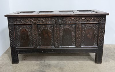 Lot 478 - A 17th century carved oak coffer, a four panel...