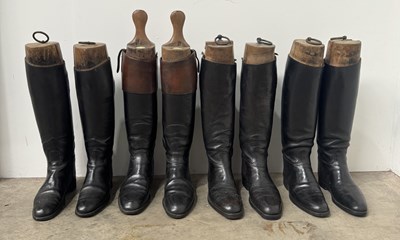 Lot 52 - Four pairs of black leather riding boots,...