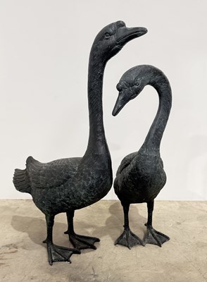 Lot 430 - A pair of cast metal geese sculptures,...