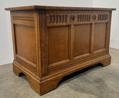 Lot 443 - A small light oak panelled chest or coffer,...
