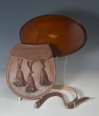 Lot 187 - A leather sporran with tassels, 21cm long,...