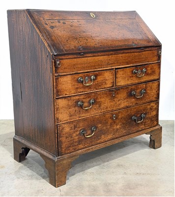 Lot 480 - An 18th century oak bureau: opening to a...