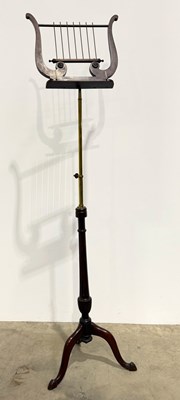 Lot 462 - A 19th century lyre shaped mahogany and brass...