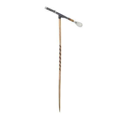 Lot 232 - A yellow novelty metal stick pin surmounted by...