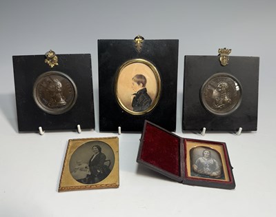 Lot 167 - A group of portrait miniatures: a young sailor...